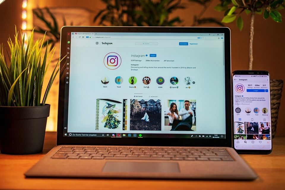 Instagram on laptop and phone