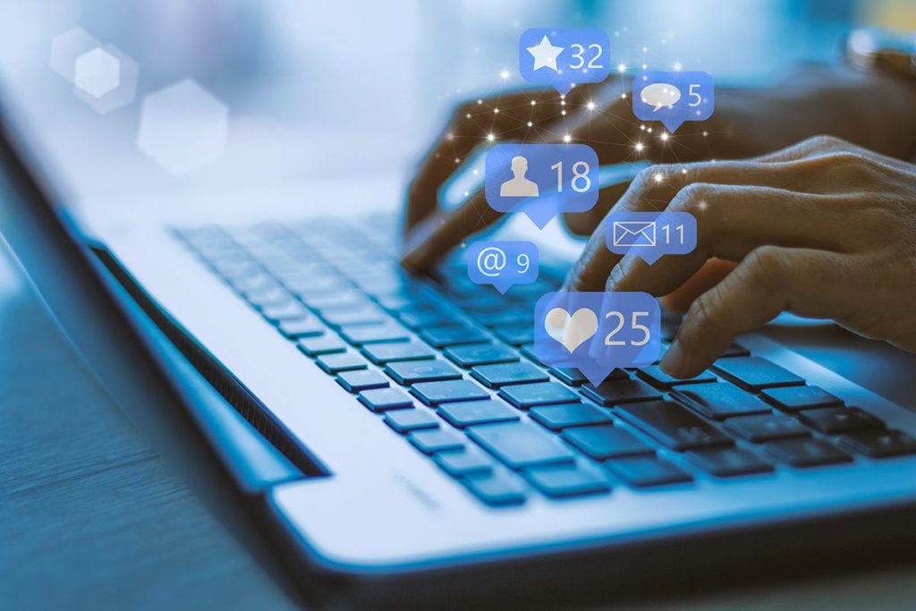 Social media interaction on laptop