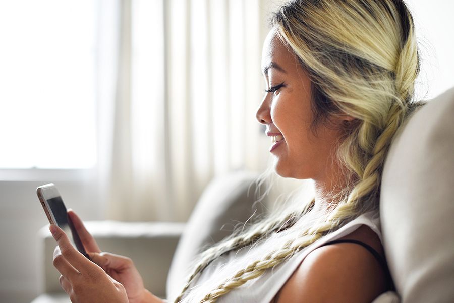 Girl reading text message on phone