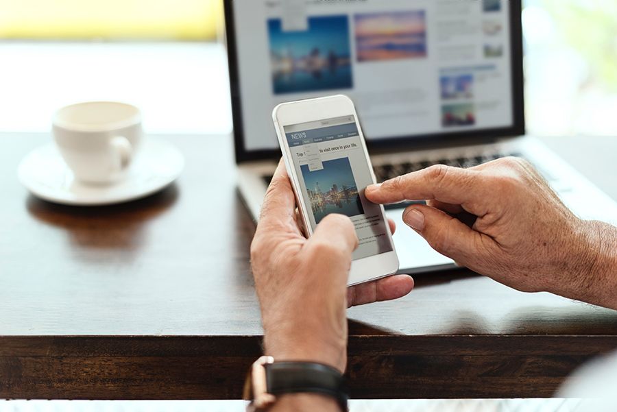 Person looking at responsive website on mobile