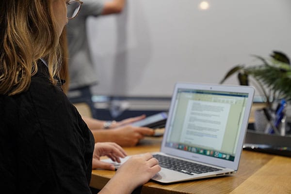 woman QA testing and content proofing document