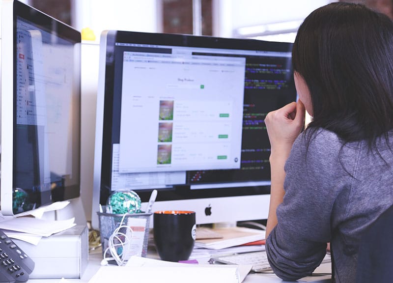 woman working on website computer